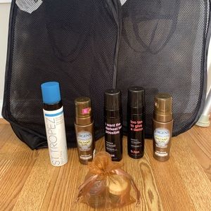 5 self tanning, tanning foam tanners, 2 black folding mesh hampers and 2 candles